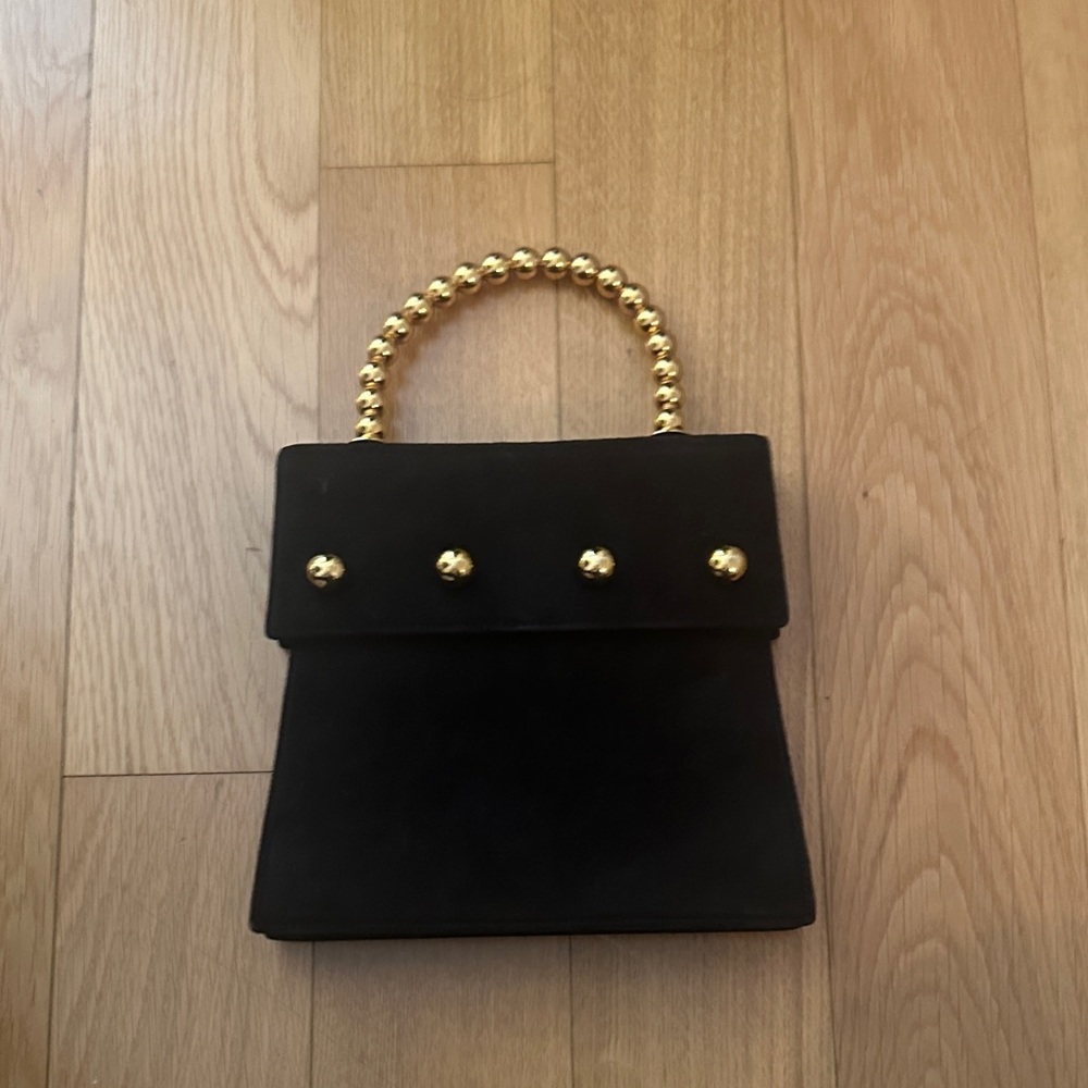 Paloma Picasso Elegant Black Handbag with Gold Accents